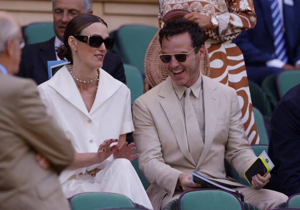 Tennis - Wimbledon - All England Lawn Tennis and Croquet Club, London, Britain - July 13, 2025 Actors Keira Knightley and Andrew Scott in the royal box in centre court before the women's doubles final match REUTERS/Andrew Couldridge