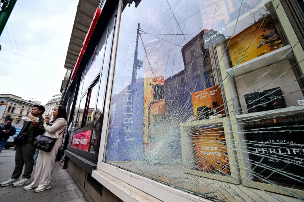 Milan shopfronts boarded up after weekend protest clashes
